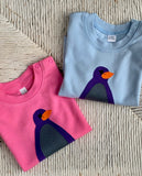 Long sleeved bubblegum pink and baby blue organic cotton t-shirts for babies with applique penguin on the front. isabee