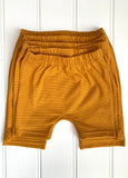 Baby shorts in fine stripe yellow - soft jersey cotton. Designed to be worn over a nappy. isabee.co.uk