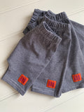Baby shorts in fine stripe blue - soft jersey cotton. Designed to be worn over a nappy. isabee.co.uk