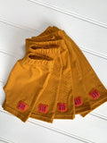 Baby shorts in fine stripe yellow - soft jersey cotton. Designed to be worn over a nappy. isabee.co.uk