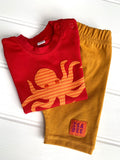Baby Octopus organic cotton T-shirt in red with orange stripy octopus on the front and soft jersey cotton shorts in fine stripe yellow - isabee.co.uk