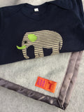 Handmade fleece baby blanket in Light Grey with matching satin trim. Shown with Baby Elephant navy blue sleepsuit for babies - isabee.co.uk