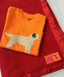 Handmade fleece baby blanket in Red with matching satin trim.  Shown with Baby Labrador orange t-shirt for babies - isabee.co.uk
