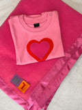 Handmade fleece baby blanket in Candy Pink with matching satin trim. Shown with Baby Heart pink t-shirt for babies - isabee.co.uk