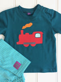 100% organic cotton baby t-shirt in teal with red applique train and orange steam. Shown with soft cotton turquoise and green stripy leggings. Handmade by Isabee.co.uk.