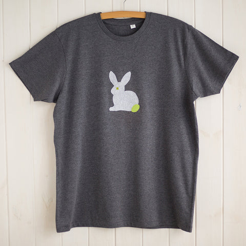 Dark grey melange unisex or men's fit t-shirt featuring a light grey appliqued rabbit with a leaf green tail. T-shirt is displayed on a hanger in front of a white panelled background. - isabee.co.uk