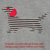 Design detail of children's t-shirt featuring an appliqued, navy and cream striped dachshund with red details. - isabee.co.uk