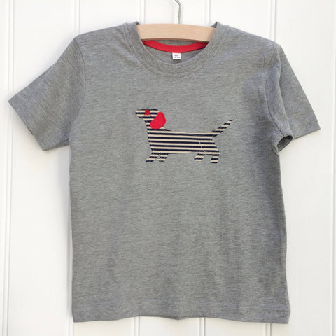 Grey melange children's t-shirt featuring an appliqued, navy and cream striped dachshund with red details. T-shirt is displayed upon a white panelled background. - isabee.co.uk
